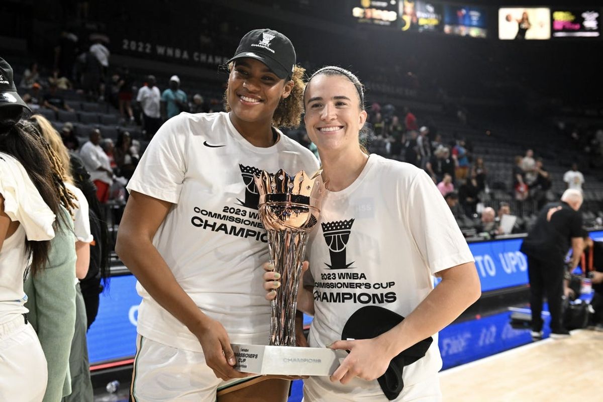 Aug 15, 2023; Las Vegas, Nevada, USA; New York Liberty forward Nyara Sabally (8) and guard Sabrina Ionescu (20) pose with the Commissioner   s Cup after defeating the Las Vegas Aces at Michelob Ultra Arena. Mandatory Credit: Candice Ward-USA TODAY Sports