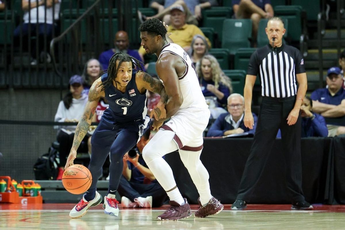 Nov 23, 2023; Kissimmee, FL, USA;  Texas A&M Aggies forward Henry Coleman III (15) guards Penn State Nittany Lions guard Ace Baldwin Jr. (1) in the second half during the ESPN Events Invitational at State Farm Field House.