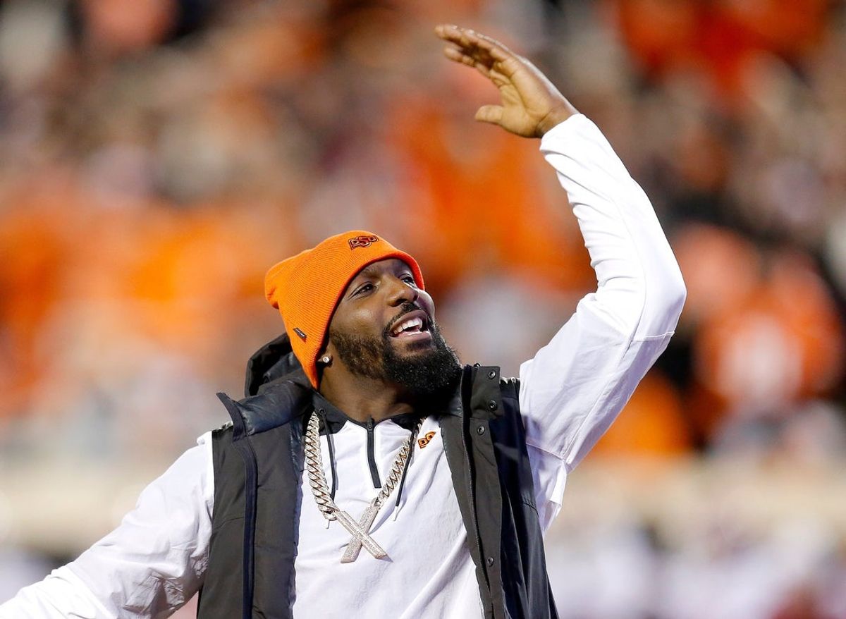 Dez Bryant pumps up the crowd during a Bedlam college football game between the Oklahoma State University Cowboys (OSU) and the University of Oklahoma Sooners (OU) at Boone Pickens Stadium in Stillwater, Okla., Saturday, Nov. 27, 2021.