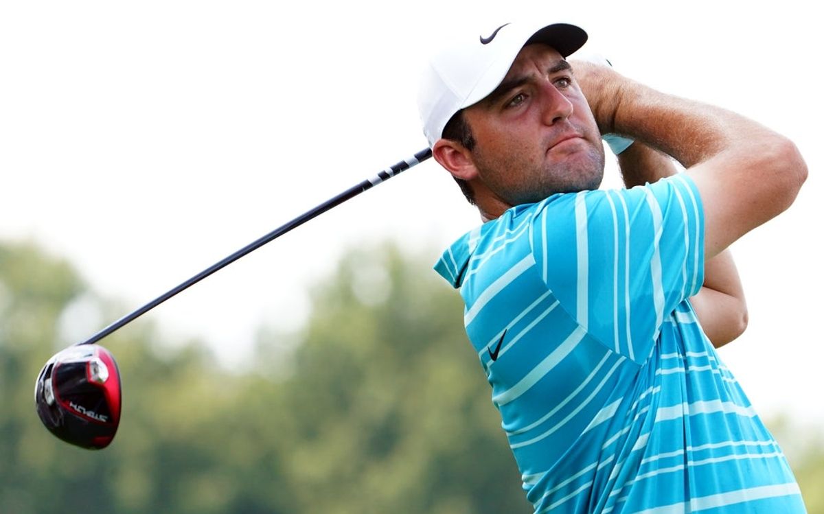 Aug 26, 2023; Atlanta, Georgia, USA; Scottie Scheffler plays his shot from the fourth tee during the third round of the TOUR Championship golf tournament at East Lake Golf Club. Mandatory Credit: John David Mercer-Imagn Images