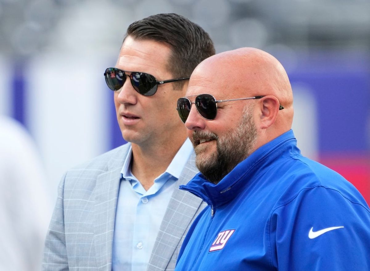 Aug 26, 2023; East Rutherford, New Jersey, USA; New York Giants head coach Brian Daboll (right) and general manager Joe Schoen (left) talk before a game against the New York Jets at MetLife Stadium. Mandatory Credit: Robert Deutsch-Imagn Images