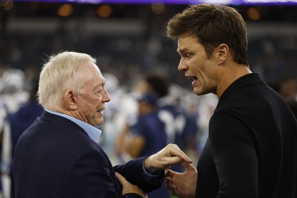 Dallas Cowboys owner Jerry Jones (L) talks to Tom Brady (R) before the game against the Las Vegas Raiders in August. Brady's ownership stake in the Raiders was approved by league owners on Tuesday. Mandatory Credit: Tim Heitman-Imagn Images