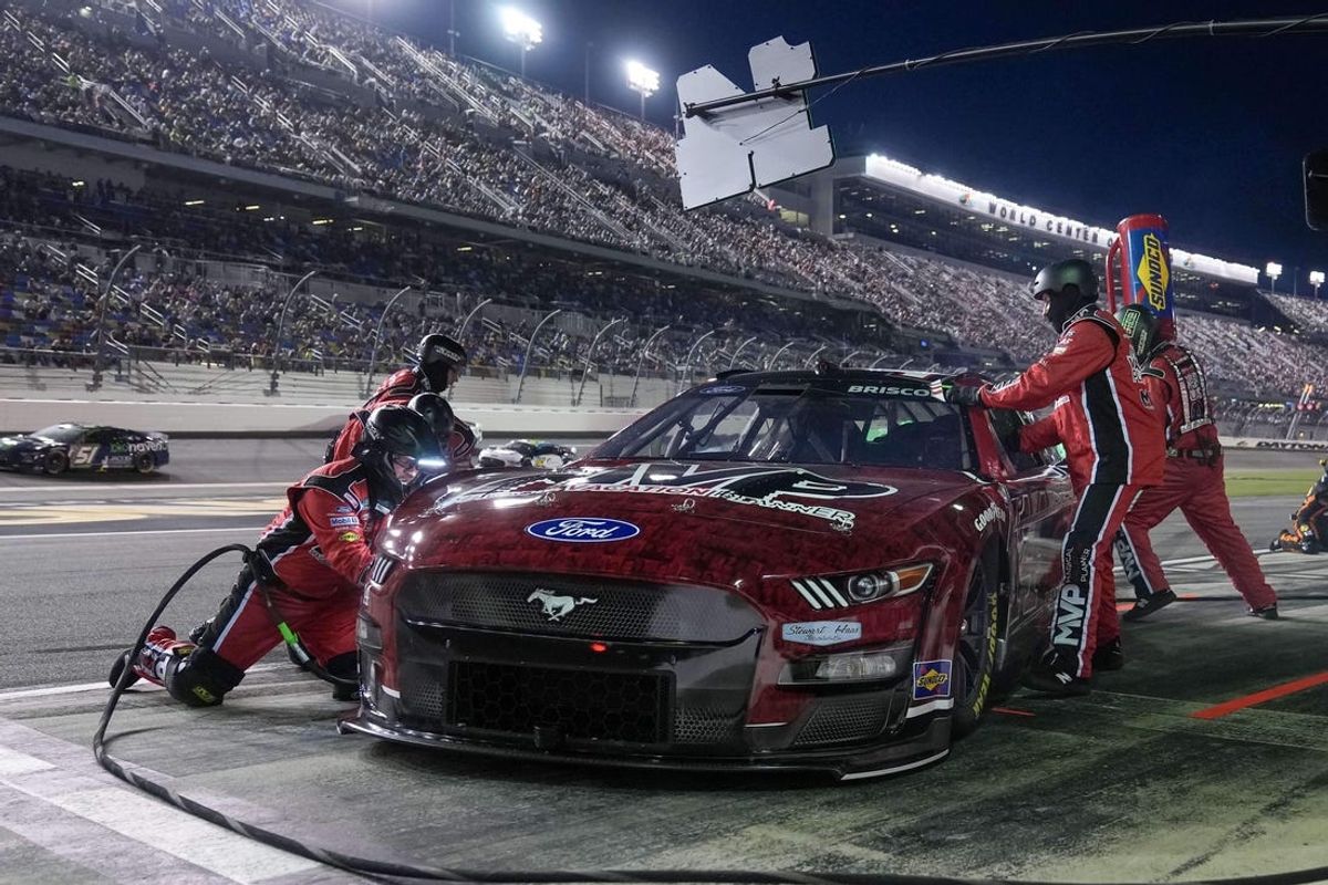 Aug 25, 2023; Daytona Beach, Florida, USA;  NASCAR Cup Series driver Chase Briscoe (14) makes a pit stop during the Coke Zero Sugar 400 at Daytona International Speedway. Mandatory Credit: David Yeazell-USA TODAY Sports