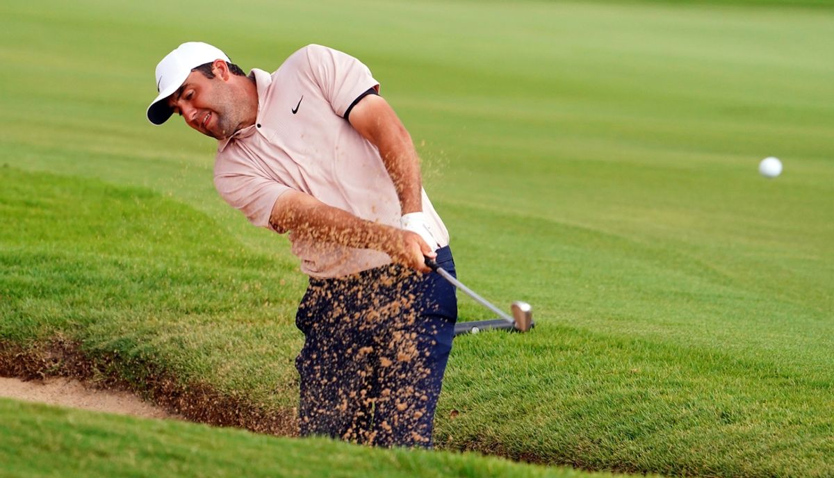 Aug 27, 2023; Atlanta, Georgia, USA; Scottie Scheffler plays a shot from a bunker on the eighth hole during the final round of the TOUR Championship golf tournament at East Lake Golf Club. Mandatory Credit: John David Mercer-Imagn Images