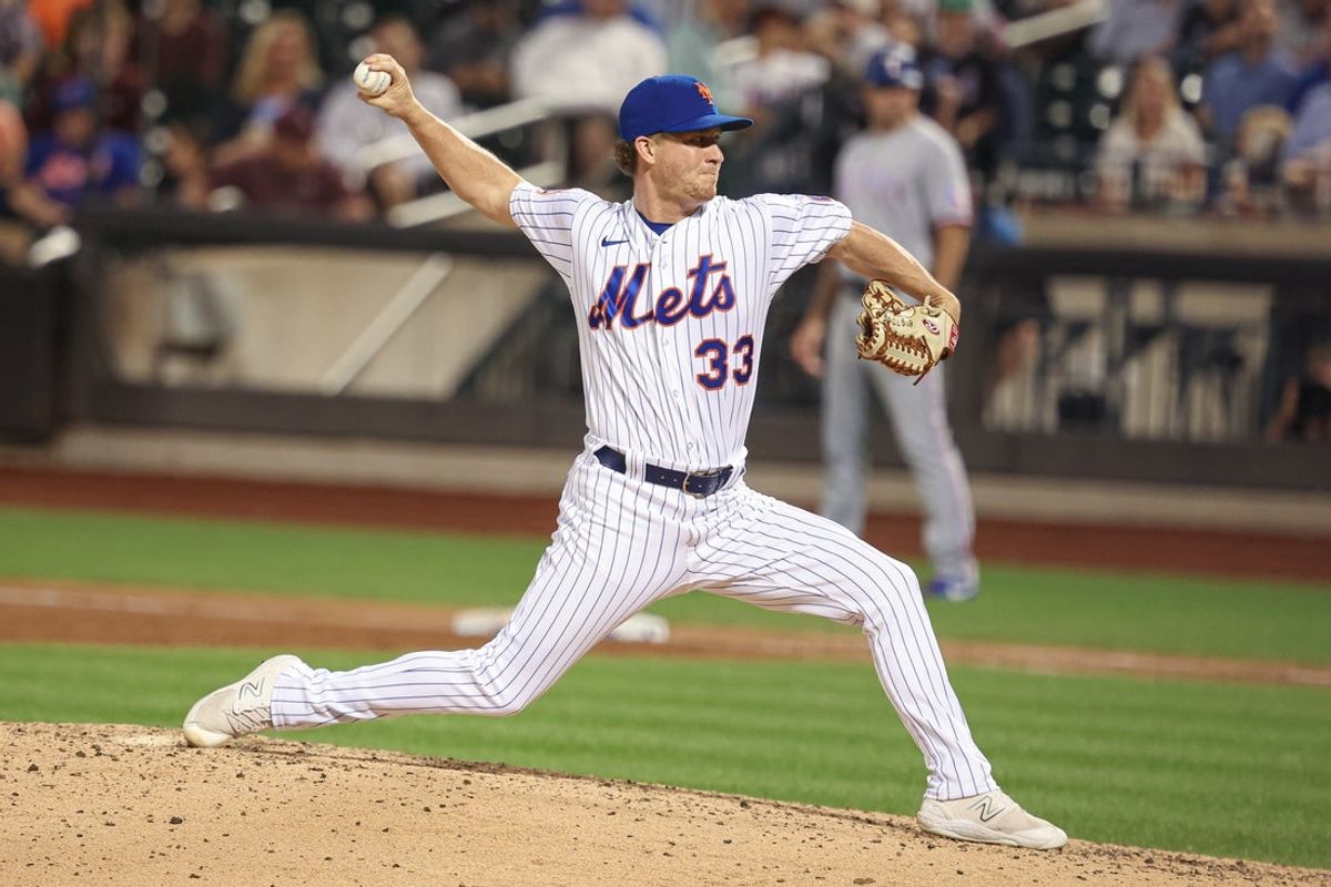Aug 28, 2023; New York City, New York, USA; New York Mets relief pitcher Trevor Gott (33) delivers a pitch during the ninth inning against the Texas Rangers at Citi Field. Mandatory Credit: Vincent Carchietta-Imagn Images