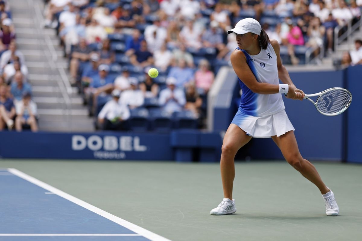 Aug 30, 2023; Flushing, NY, USA; Iga Swiatek gf Poland hits a backhand against Daria Saville of Australia (not pictured) on day three of the 2023 U.S. Open tennis tournament at USTA Billie Jean King National Tennis Center. Mandatory Credit: Geoff Burke-Imagn Images