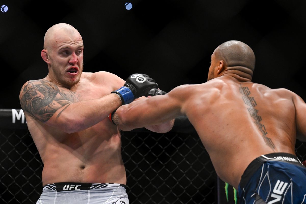 Sep 2, 2023; Paris, France; Ciryl Gane (red gloves) fights Serghei Spivac (blue gloves) during UFC Fight Night at Accor Arena. Mandatory Credit: Per Haljestam-USA TODAY Sports