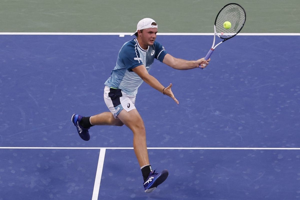 Sep 3, 2023; Flushing, NY, USA; Dominic Stricker of Switzerland hits a volley against Taylor Fritz of the United States (not pictured) on day seven of the 2023 U.S. Open tennis tournament at USTA Billie Jean King National Tennis Center. Mandatory Credit: Geoff Burke-Imagn Images