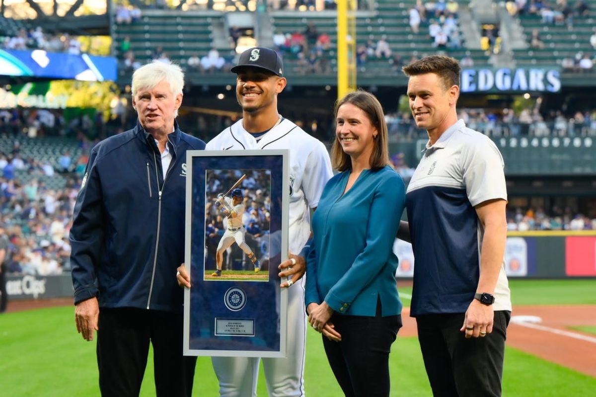 Sep 11, 2023; Seattle, Washington, USA; Seattle Mariners chairman John Stanton, president of business operations Catie Griggs and president of baseball operations Jerry Dipoto present the MLB August AL Player of the Month award to Julio Rodriguez (44) prior to the game between the Mariners and the Los Angeles Angels at T-Mobile Park. Mandatory Credit: Steven Bisig-USA TODAY Sports