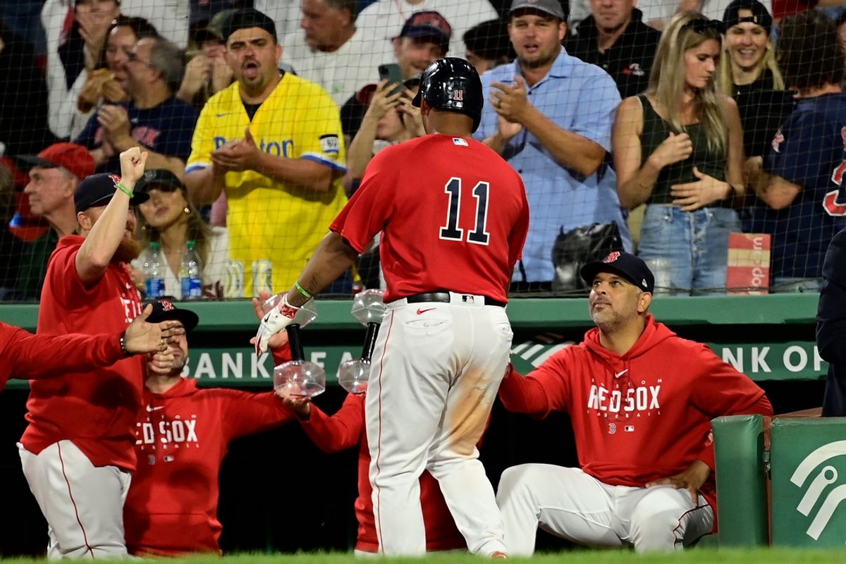 Sep 14, 2023; Boston, Massachusetts, USA; Boston Red Sox designated hitter Rafael Devers (11) celebrates his home run against the New York Yankees with manager Alex Cora (13) during the third inning at Fenway Park. Mandatory Credit: Eric Canha-Imagn Images