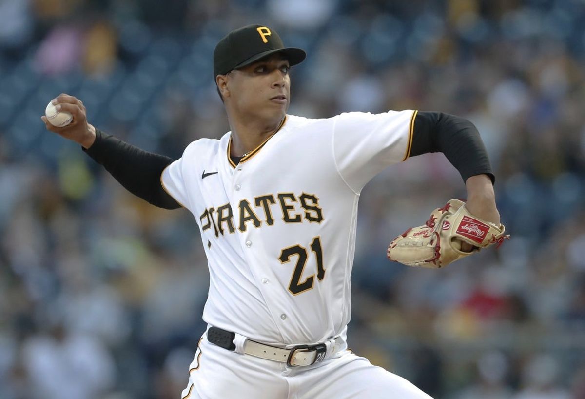 Sep 15, 2023; Pittsburgh, Pennsylvania, USA;  Pittsburgh Pirates starting pitcher Johan Oviedo (24 wearing 21) delivers a pitch against the New York Yankees during the first inning at PNC Park. Mandatory Credit: Charles LeClaire-Imagn Images