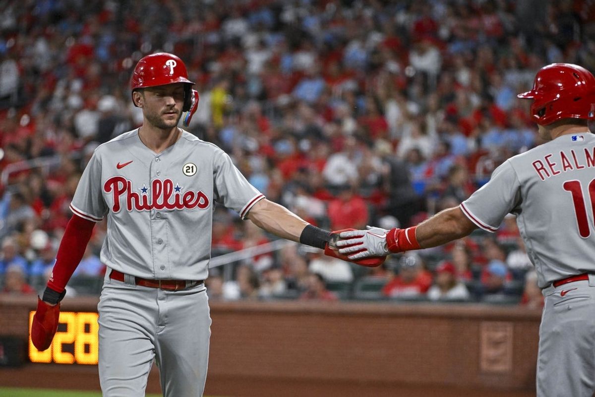 Sep 15, 2023; St. Louis, Missouri, USA;  Philadelphia Phillies shortstop Trea Turner (7) is congratulated by catcher J.T. Realmuto (10) after scoring against the St. Louis Cardinals during the first inning at Busch Stadium. Mandatory Credit: Jeff Curry-Imagn Images