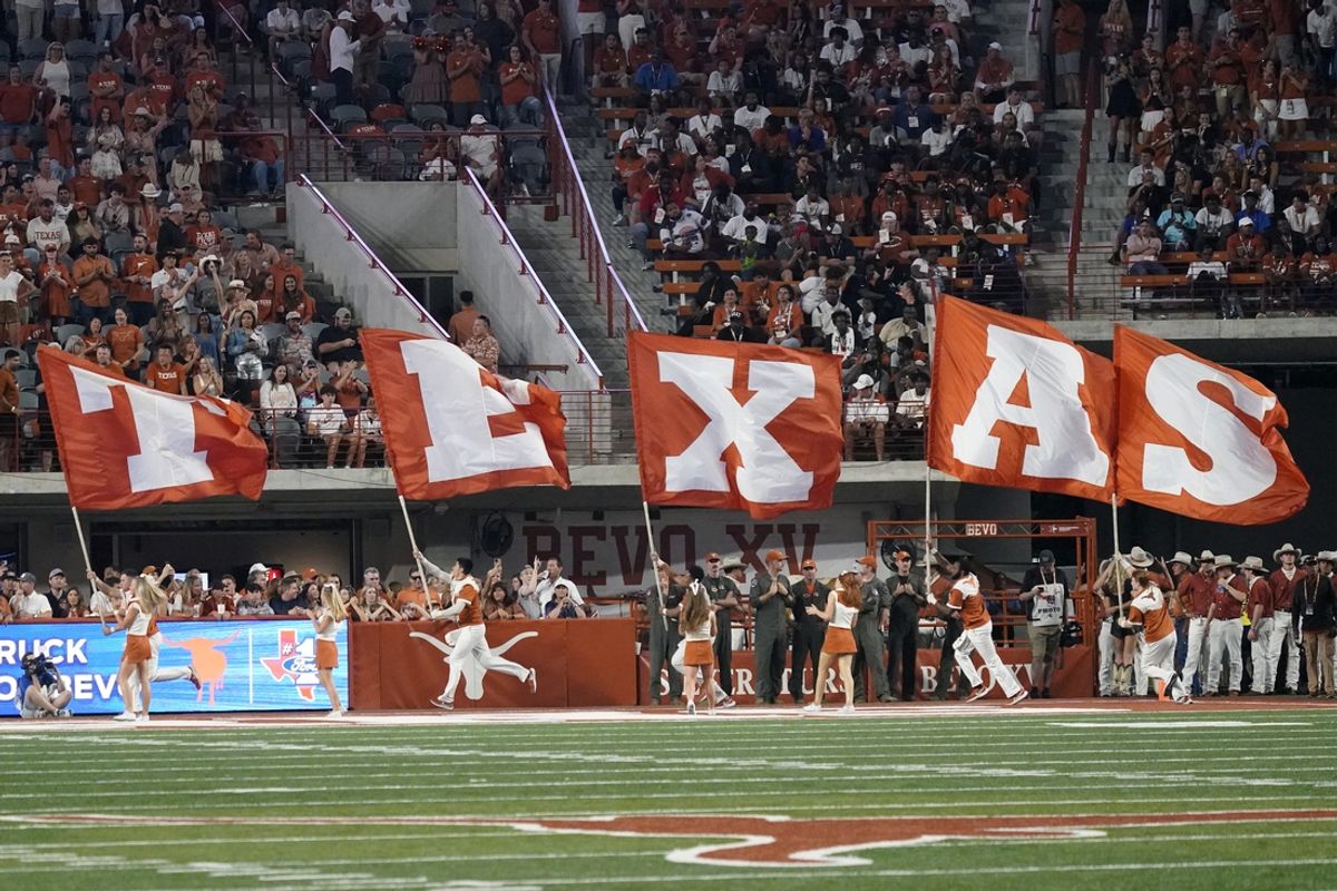 Sep 16, 2023; Austin, Texas, USA; Texas flags on the field after the Longhorns scored a touchdown during the second half against the Wyoming Cowboys at Darrell K Royal-Texas Memorial Stadium. Mandatory Credit: Scott Wachter-USA TODAY Sports