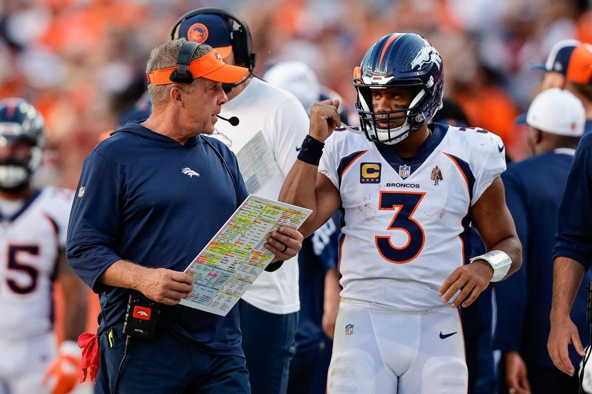 Sep 17, 2023; Denver, Colorado, USA; Denver Broncos head coach Sean Payton talks with quarterback Russell Wilson (3) in the fourth quarter against the Washington Commanders at Empower Field at Mile High. Mandatory Credit: Isaiah J. Downing-Imagn Images