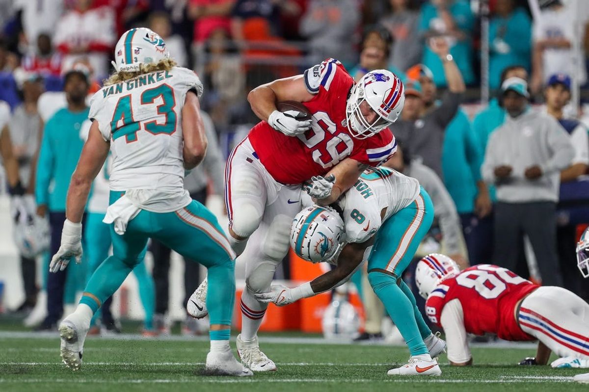 Sep 17, 2023; Foxborough, Massachusetts, USA; New England Patriots guard Cole Strange (69) runs the ball during the second half against the Miami Dolphins at Gillette Stadium. Mandatory Credit: Paul Rutherford-USA TODAY Sports