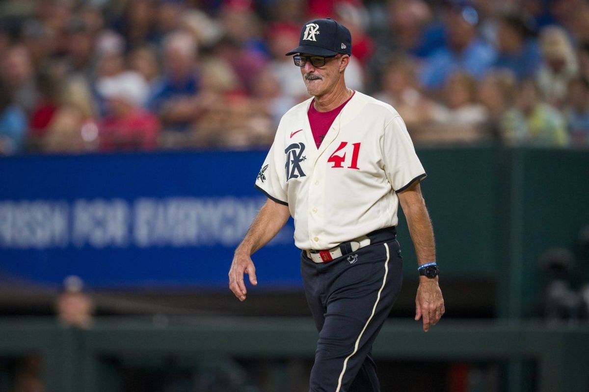 Sep 22, 2023; Arlington, Texas, USA; Texas Rangers pitching coach Mike Maddux (41) walks to the pitchers mound during the game against the Seattle Mariners at Globe Life Field. Mandatory Credit: Jerome Miron-Imagn Images