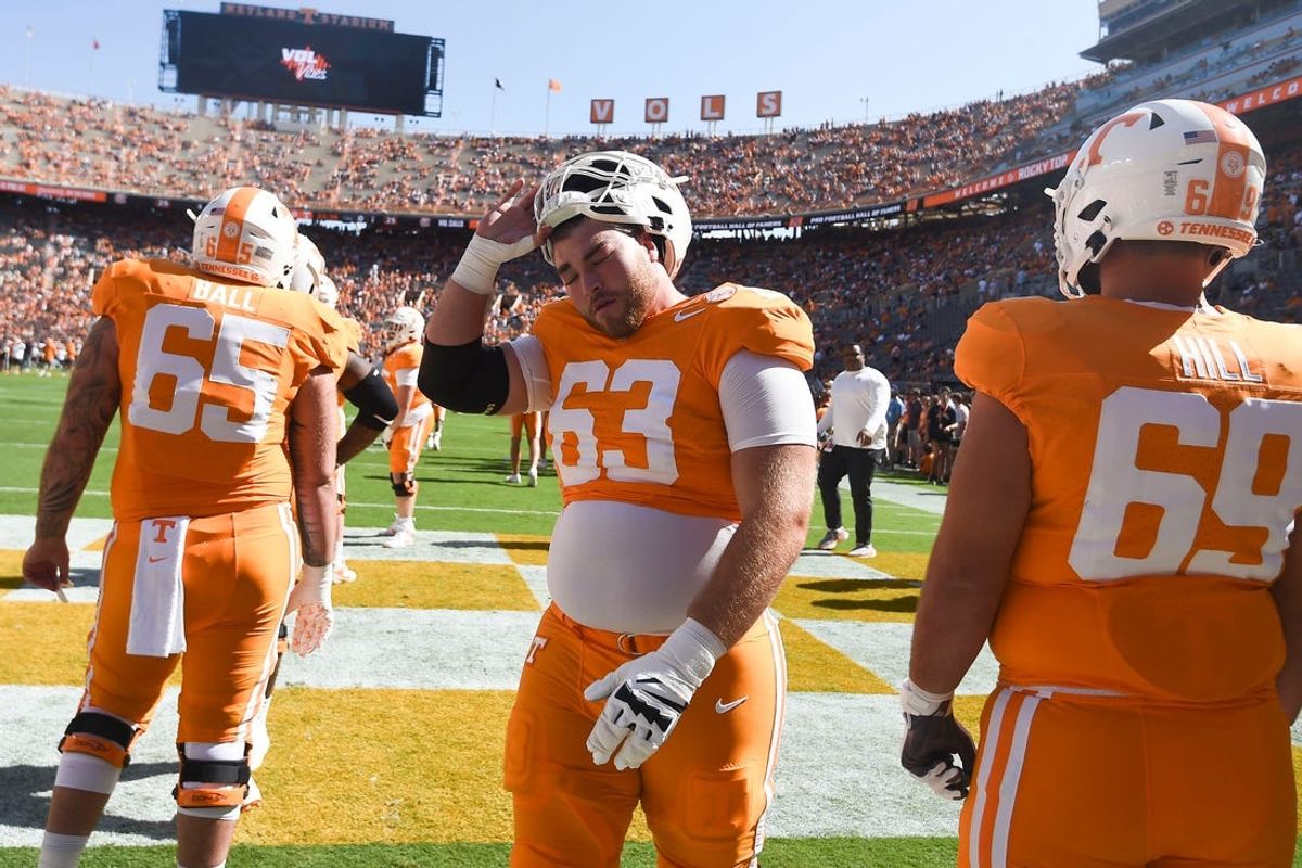 Tennessee offensive lineman Cooper Mays (63) removes his helmet while warming up before the start of the NCAA college football game against UTSA on Saturday, September 23, 2023 in Knoxville, Tenn.