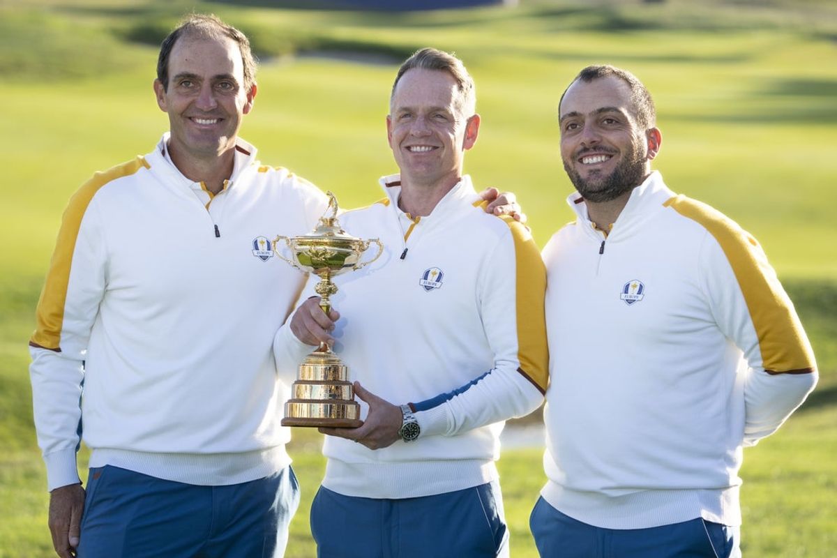 September 26, 2023; Rome, ITALY; (L-R) Team Europe vice-captain Edoardo Molinari, captain Luke Donald, and vice-captain Francesco Molinari pose for a photo with The Ryder Cup trophy during a practice round of the Ryder Cup golf competition at Marco Simone Golf and Country Club. Mandatory Credit: Kyle Terada-Imagn Images