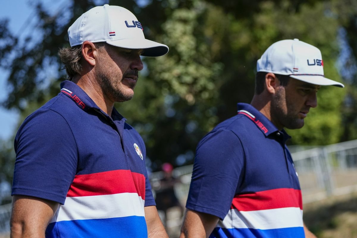 Sep 27, 2023; Rome, ITA; Team USA golfer Brooks Koepka walks with Scottie Scheffler during a practice day for the Ryder Cup golf competition at Marco Simone Golf and Country Club. Mandatory Credit: Adam Cairns-Imagn Images