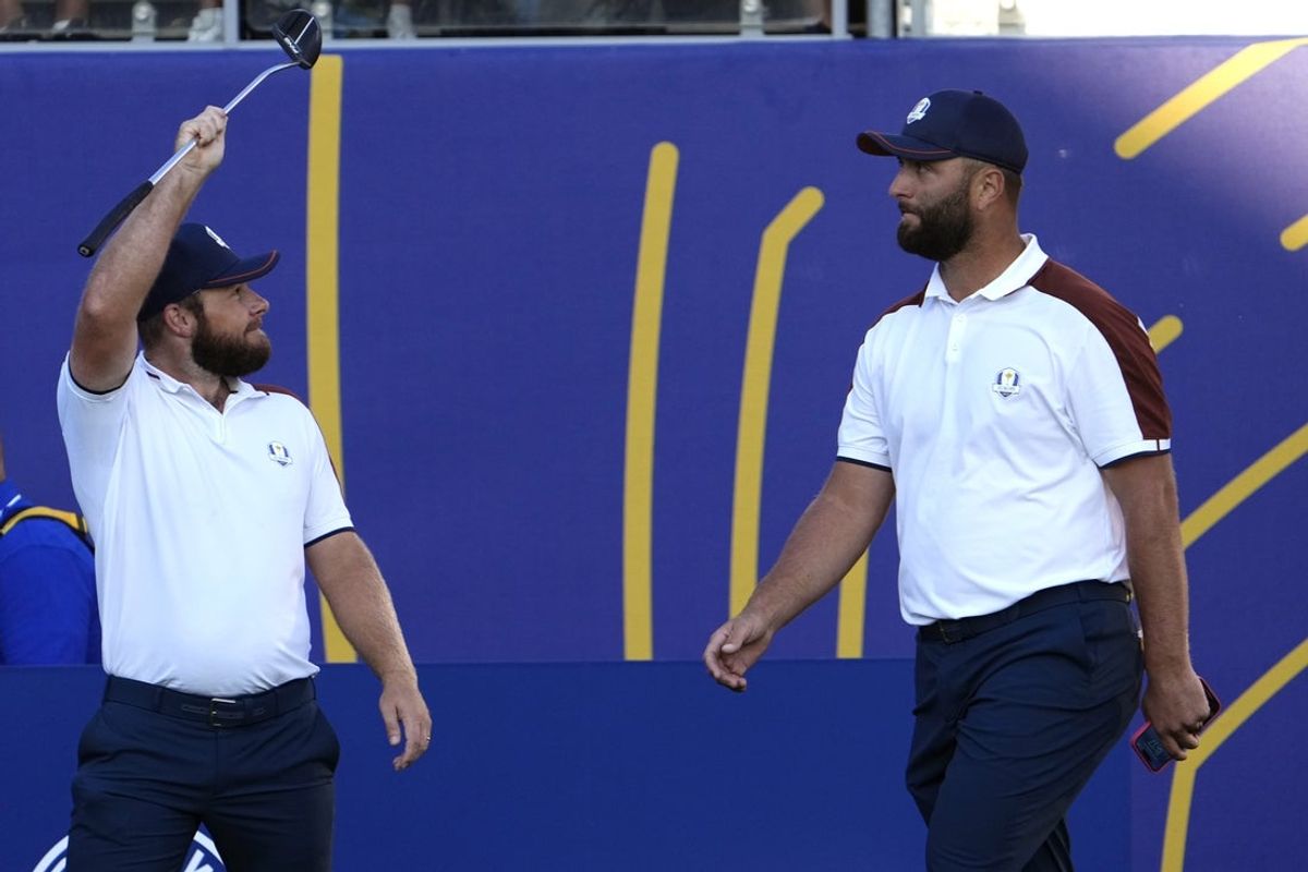 Sep 30, 2023; Rome, ITA; Team Europe golfers Tyrrell Hatton (left) and Jon Rahm during day two foursomes round for the 44th Ryder Cup golf competition at Marco Simone Golf and Country Club. Mandatory Credit: Adam Cairns-Imagn Images