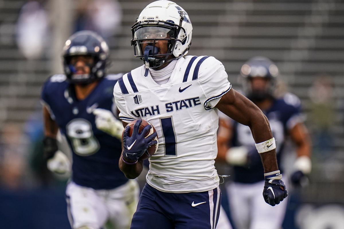 Sep 30, 2023; East Hartford, Connecticut, USA; Utah State Aggies wide receiver Jalen Royals (1) runs the ball for a touchdown against the UConn Huskies in the second half at Rentschler Field at Pratt & Whitney Stadium. Mandatory Credit: David Butler II-Imagn Images