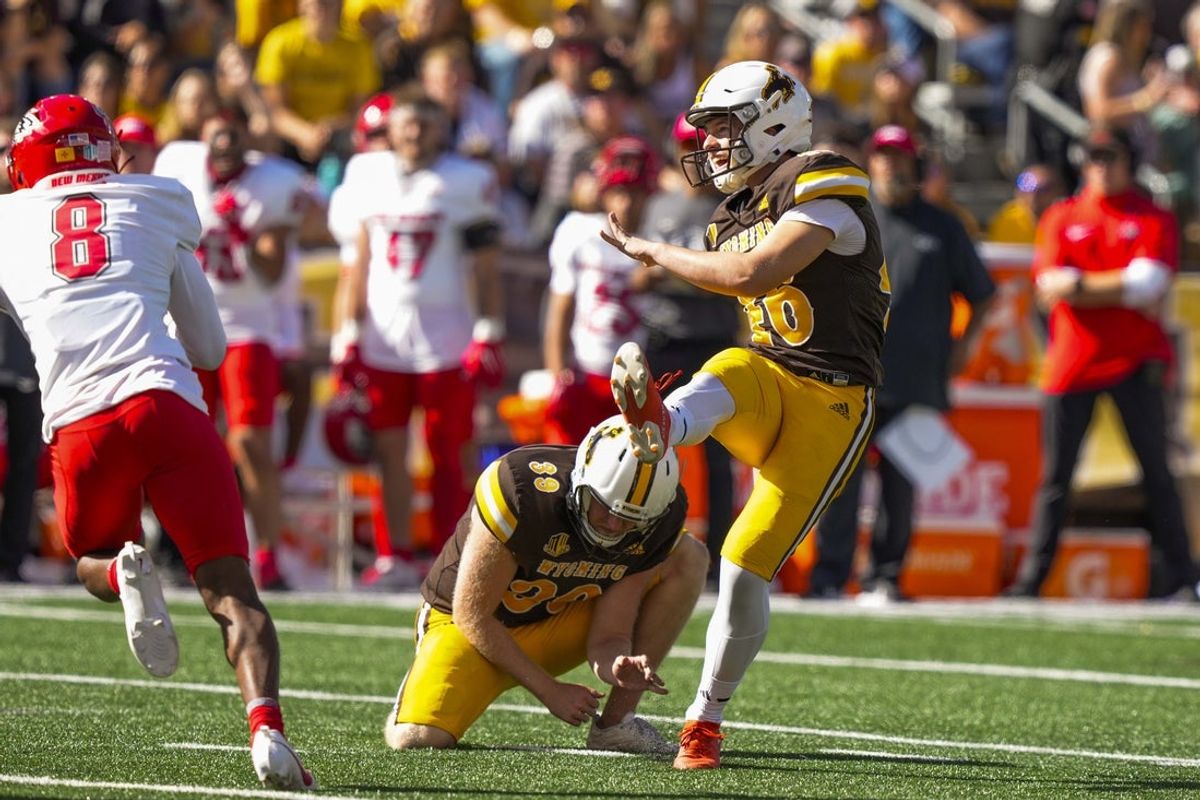 Sep 30, 2023; Laramie, Wyoming, USA; Wyoming Cowboys kicker John Hoyland (46) kicks a field goal against the New Mexico Lobos during the second quarter at Jonah Field at War Memorial Stadium. Mandatory Credit: Troy Babbitt-Imagn Images