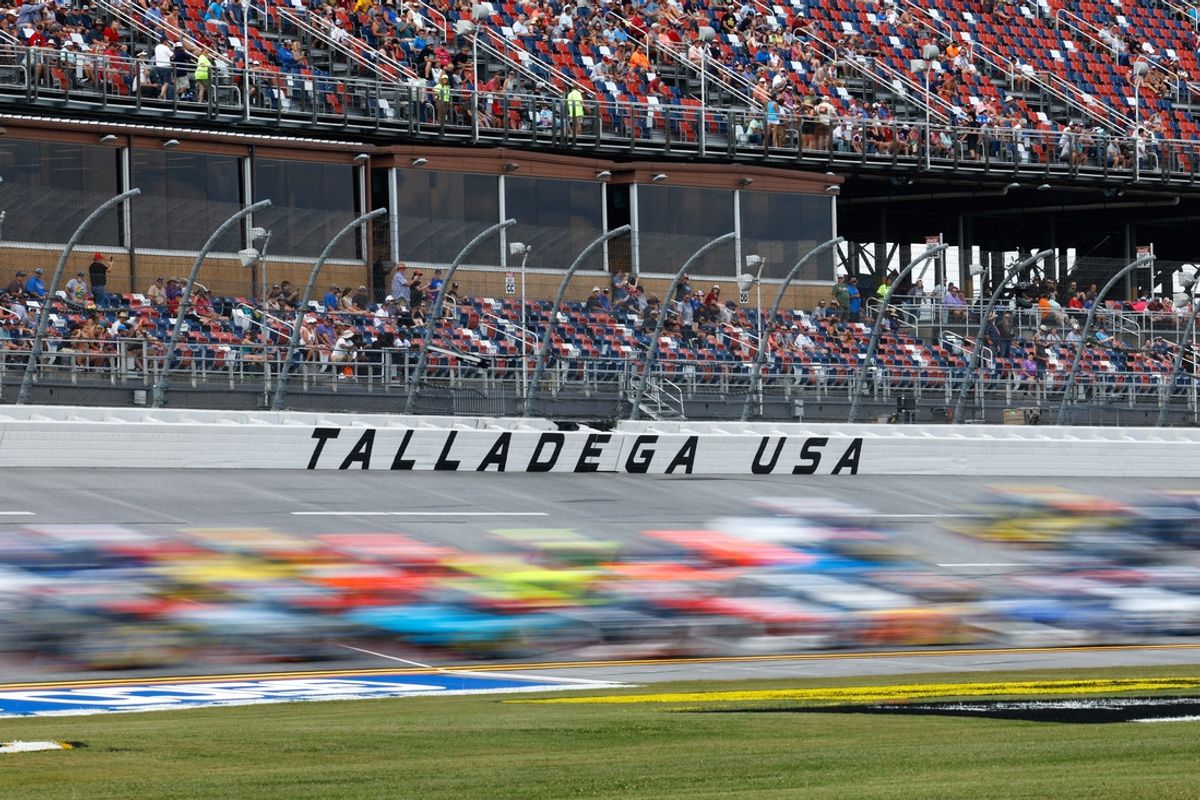 Sep 30, 2023; Talladega, Alabama, USA; General view of the pack passing a Talladega sign during the Love s RV Stop 250 at Talladega Superspeedway. Mandatory Credit: Douglas DeFelice-Imagn Images