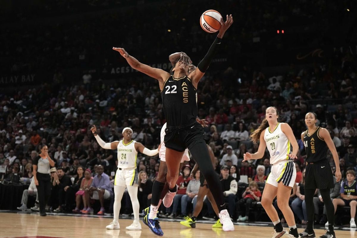 Sep 24, 2023; Las Vegas, Nevada, USA; Las Vegas Aces center A'ja Wilson (22) shoots the ball against Dallas Wings forward Natasha Howard (6) during game one of the 2023 WNBA Semifinals at Michelob Ultra Arena. The Aces defeated the Wings 97-83. Mandatory Credit: Kirby Lee-USA TODAY Sports
