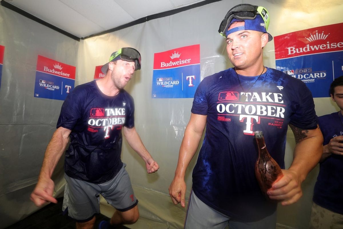 Oct 4, 2023; St. Petersburg, Florida, USA; Texas Rangers starting pitcher Max Scherzer (L) and bench coach/offensive coordinator Donnie Ecker (R) celebrate after defeating the Tampa Bay Rays in game two of the Wildcard series for the 2023 MLB playoffs at Tropicana Field. Mandatory Credit: Nathan Ray Seebeck-Imagn Images