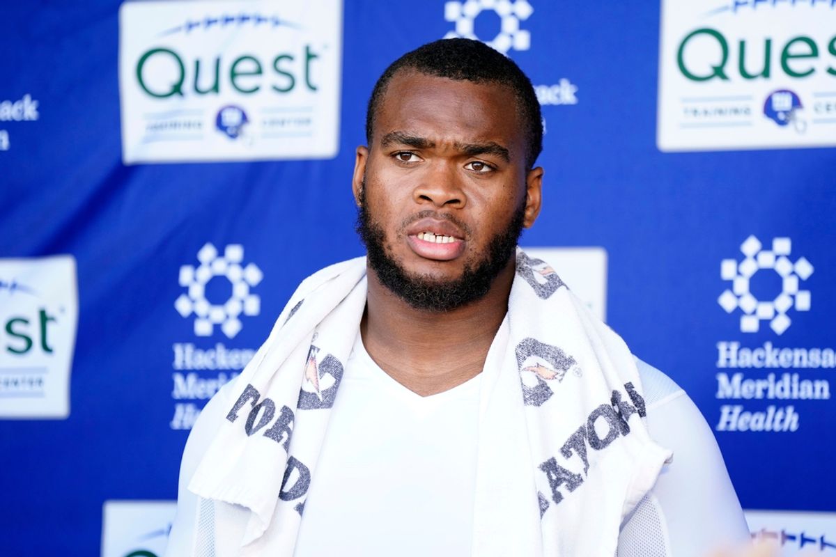 New York Giants offensive tackle Evan Neal talks to reporters after the organized team activities (OTA's) at the Giants training center on Wednesday, May 31, 2023, in East Rutherford.