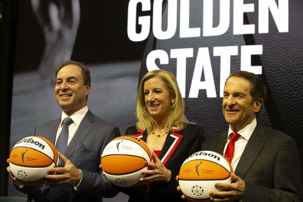 Oct 5, 2023; San Francisco, CA, USA; Golden State Warriors co-executive director & chief executive officer Joe Lacob, WNBA commissioner Cathy Engelbert and Warriors co-executive director Peter Guber pose for a group photo during a press conference to announce an expansion WNBA franchise in the San Francisco Bay Area at Chase Center. Mandatory Credit: D. Ross Cameron-USA TODAY Sports