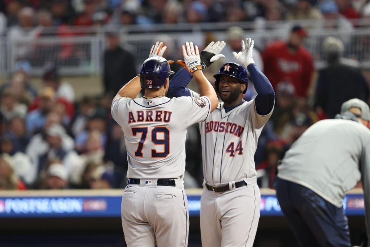 Oct 11, 2023; Minneapolis, Minnesota, USA; Houston Astros first baseman Jose Abreu (79) celebrates hitting a two-run home-run with left fielder Yordan Alvarez (44) in the fourth inning against the Minnesota Twins during game four of the ALDS for the 2023 MLB playoffs at Target Field.