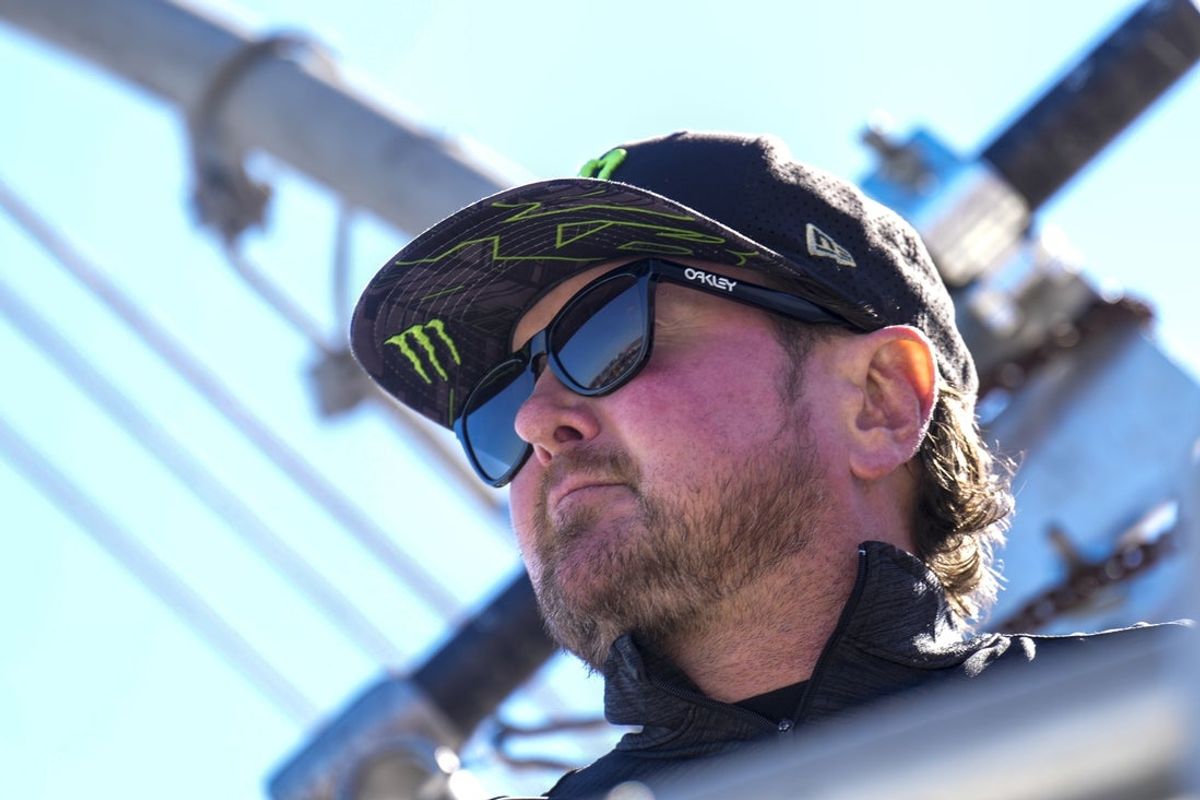 Oct 8, 2023; Concord, North Carolina, USA;  dFormer NASCAR driver Kurt Busch on the flag stand as the honorary starter during the Bank of America Roval 400 at Charlotte Motor Speedway Road Course. Mandatory Credit: Jim Dedmon-Imagn Images