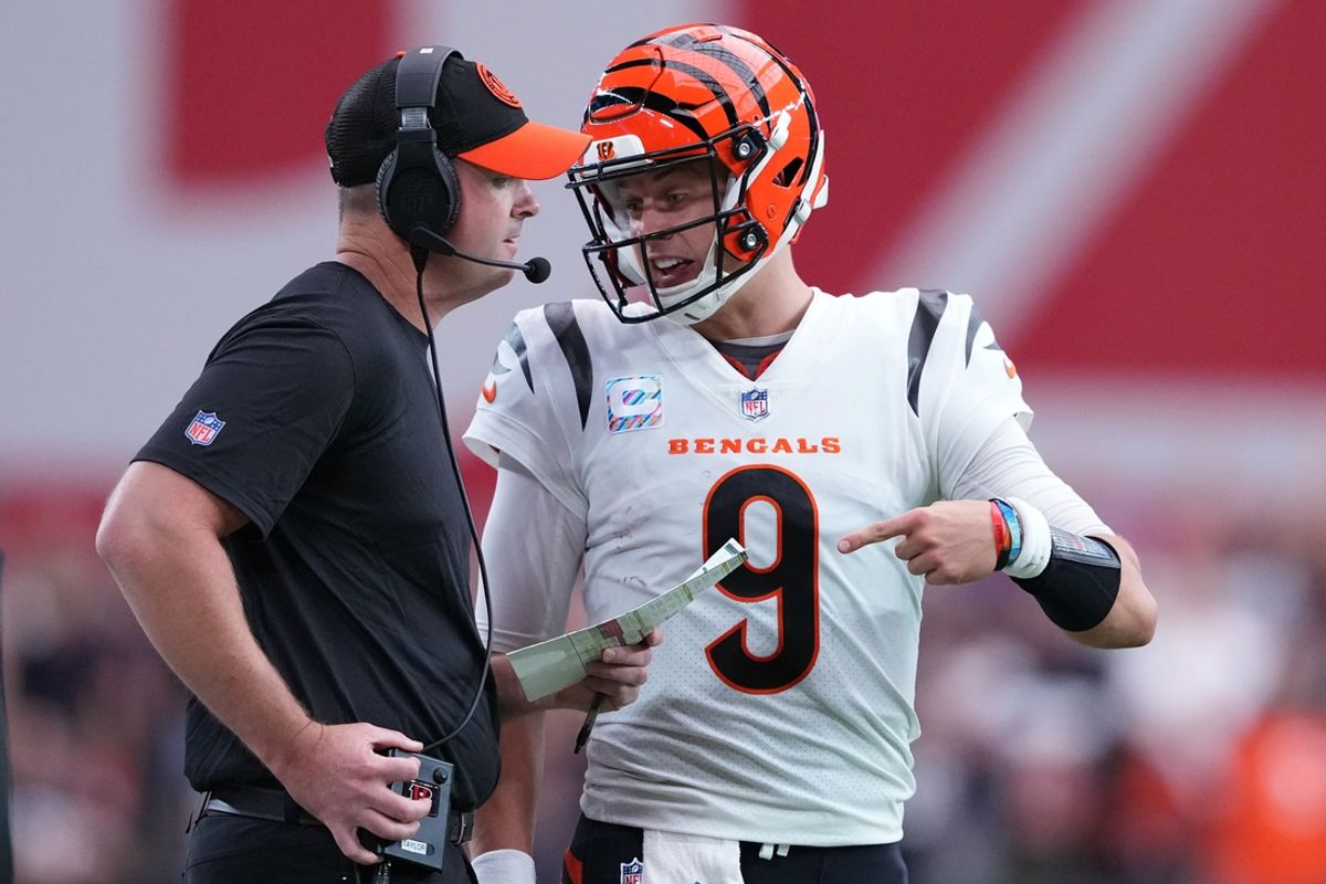 Oct 8, 2023; Glendale, Arizona, USA; Cincinnati Bengals head coach Zac Taylor and Cincinnati Bengals quarterback Joe Burrow (9) talk during the first half of the game against the Arizona Cardinals at State Farm Stadium. Mandatory Credit: Joe Camporeale-USA TODAY Sports
