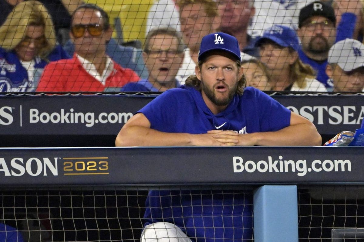 Oct 9, 2023; Los Angeles, California, USA; Los Angeles Dodgers starting pitcher Clayton Kershaw (22) looks on from the dug out against the Arizona Diamondbacks during the third inning for game two of the NLDS for the 2023 MLB playoffs at Dodger Stadium. Mandatory Credit: Jayne Kamin-Oncea-USA TODAY Sports
