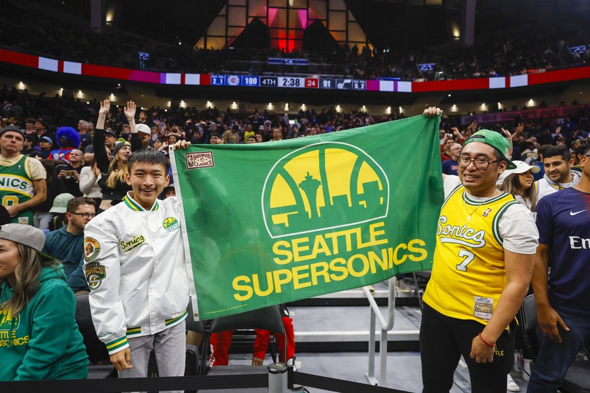 Oct 10, 2023; Seattle, Washington, USA; Fans hold a flag for the Seattle Supersonics during the fourth quarter of a game between the Utah Jazz and LA Clippers at Climate Pledge Arena. Mandatory Credit: Joe Nicholson-Imagn Images