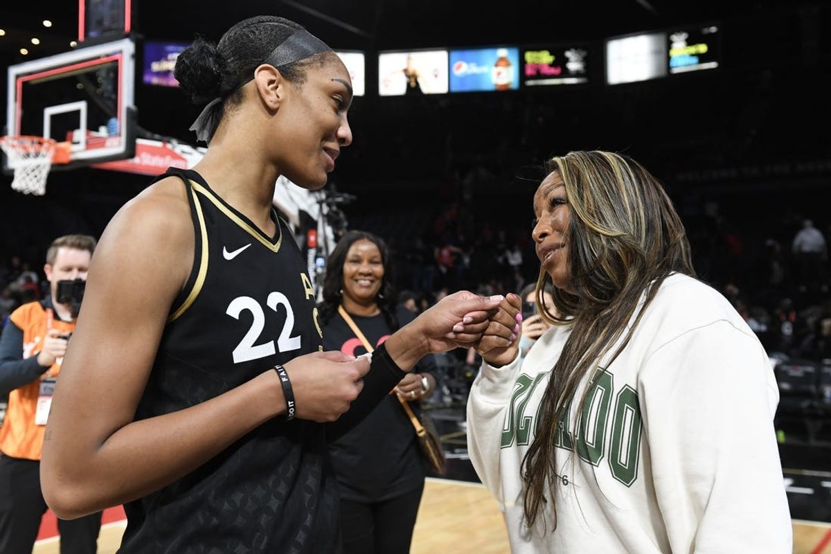 Oct 11, 2023; Las Vegas, Nevada, USA; Las Vegas Aces forward A'ja Wilson (22) greets former WNBA player Cynthia Cooper after the game against the New York Liberty during game two of the 2023 WNBA Finals at Michelob Ultra Arena. Mandatory Credit: Candice Ward-USA TODAY Sports
