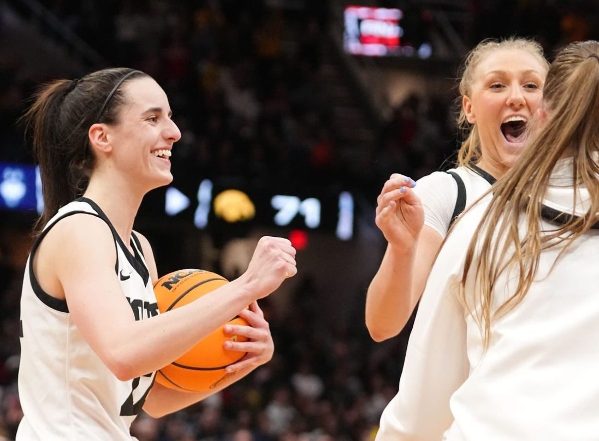 Iowa Hawkeyes guard Caitlin Clark (22) and Iowa Hawkeyes guard Sydney Affolter (3) celebrate after winning the Final Four round of the NCAA Women's Basketball Tournament between Iowa and UConn at Rocket Mortgage Fieldhouse, Friday, April 5, 2024 in Cleveland.