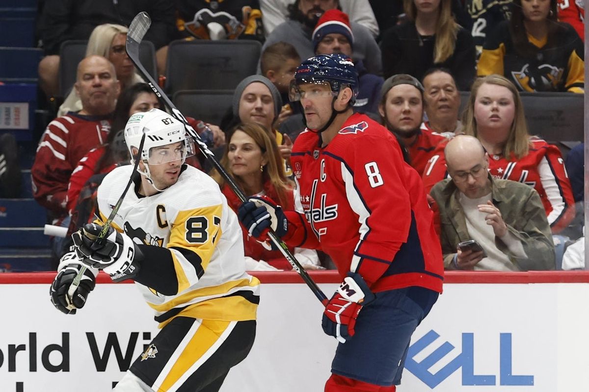 Oct 13, 2023; Washington, District of Columbia, USA; Pittsburgh Penguins center Sidney Crosby (87) and Washington Capitals left wing Alex Ovechkin (8) skate in the second period at Capital One Arena. Mandatory Credit: Geoff Burke-Imagn Images