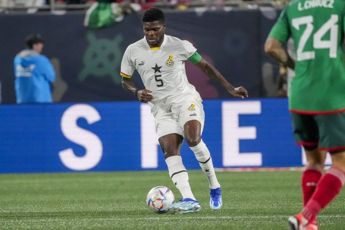 Oct 14, 2023; Charlotte, NC, USA; Ghana midfielder Thomas Partey (5) dribbles against Mexico during the first half at Bank of America Stadium. Mandatory Credit: Jim Dedmon-Imagn Images