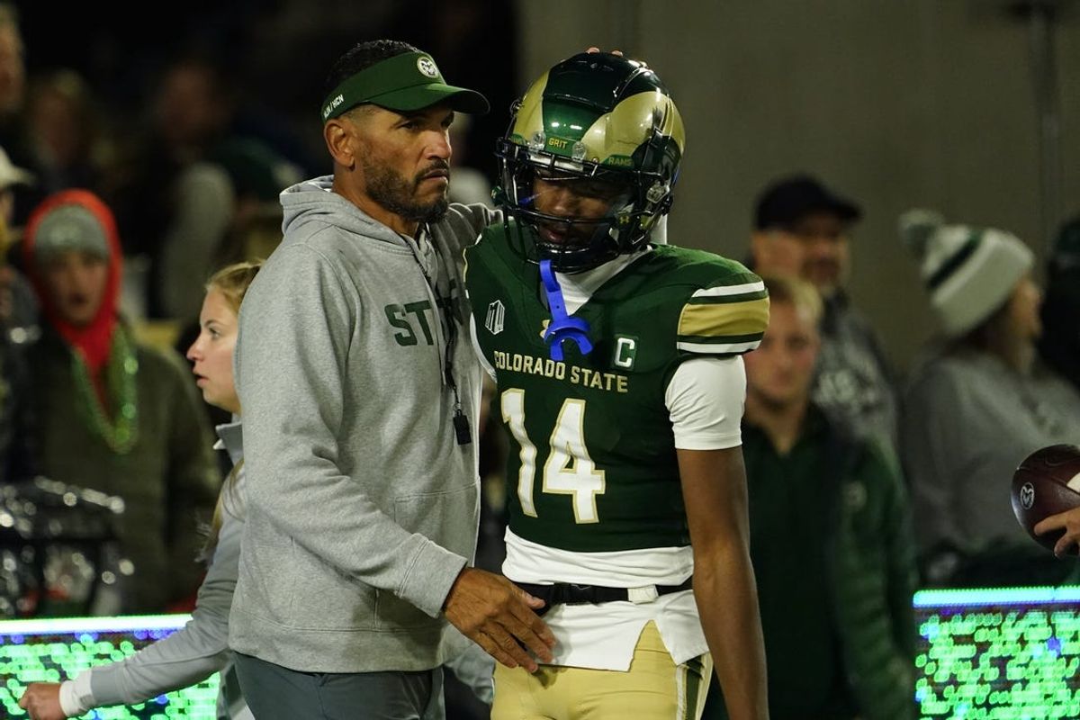 Oct 14, 2023; Fort Collins, Colorado, USA;  Colorado State Rams head coach Jay Norvell (left) hugs Colorado State Rams wide receiver Tory Horton (14) during pre-game warmups at Sonny Lubick Field at Canvas Stadium. Mandatory Credit: Michael Madrid-USA TODAY Sports