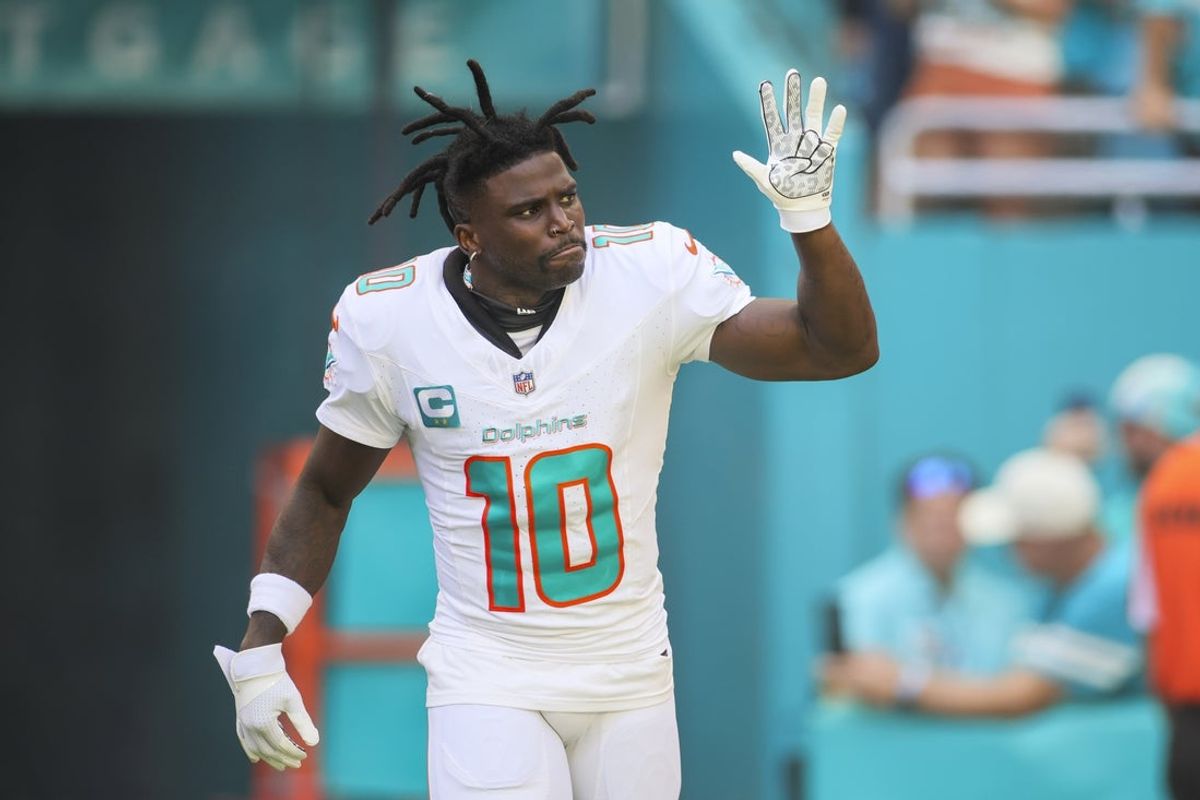 Oct 15, 2023; Miami Gardens, Florida, USA; Miami Dolphins wide receiver Tyreek Hill (10) reacts while taking on the field prior to the game against the Carolina Panthers at Hard Rock Stadium. Mandatory Credit: Sam Navarro-Imagn Images