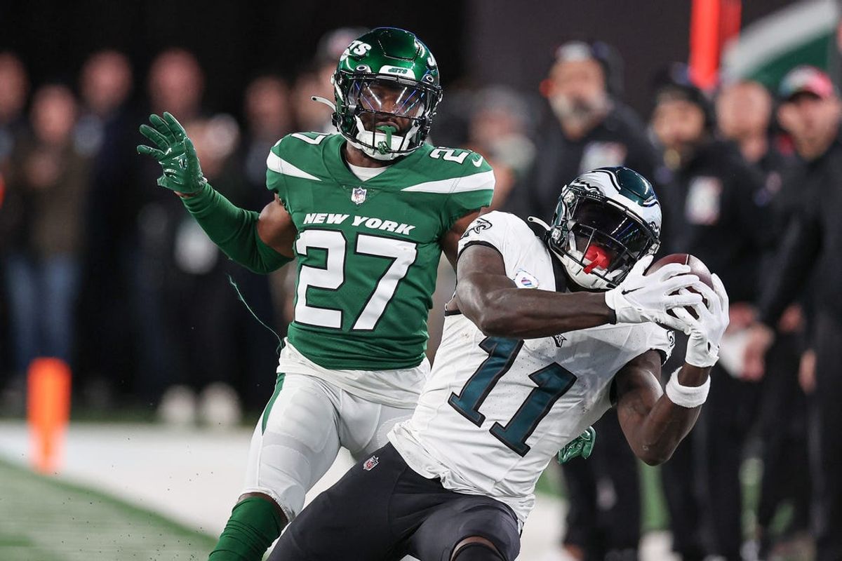 Oct 15, 2023; East Rutherford, New Jersey, USA; Philadelphia Eagles wide receiver A.J. Brown (11) catches the ball as New York Jets cornerback Tae Hayes (27) defends during the second half at MetLife Stadium. Mandatory Credit: Vincent Carchietta-USA TODAY Sports