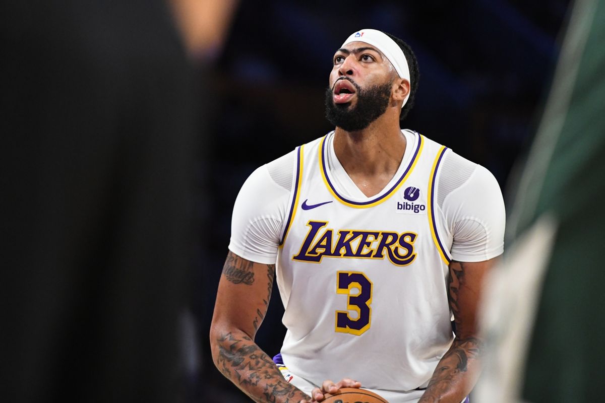 Oct 15, 2023; Los Angeles, California, USA; Los Angeles Lakers forward Anthony Davis (3) shoots a free-throw against the Milwaukee Bucks in the second quarter at Crypto.com Arena. Mandatory Credit: Jonathan Hui-Imagn Images