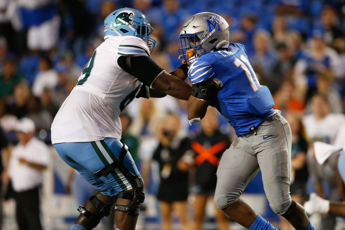 Oct 13, 2023; Memphis, Tennessee, USA; Memphis Tigers linebacker Chandler Martin (11) against Tulane Green Wave offensive linemen Rashad Green (69) during the second half at Simmons Bank Liberty Stadium. Mandatory Credit: Petre Thomas-Imagn Images