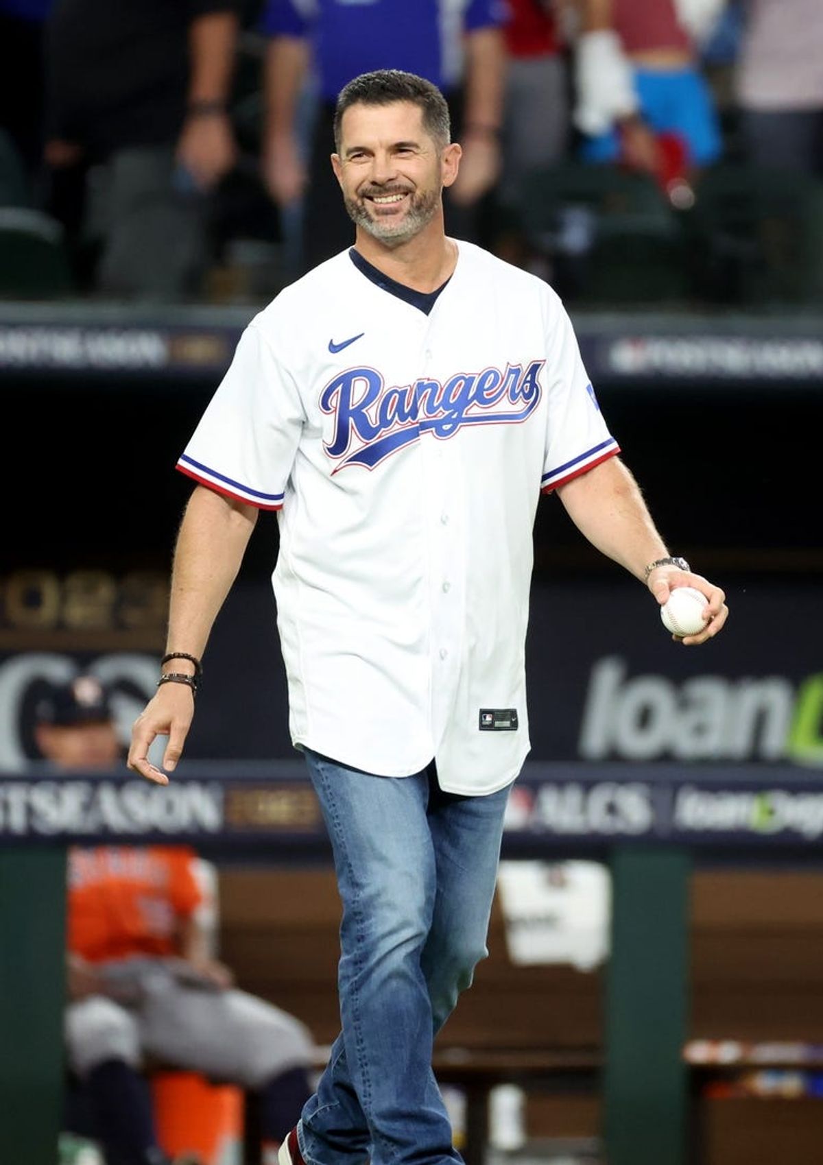 Oct 19, 2023; Arlington, Texas, USA; Texas Rangers former player Michael Young takes the field to throw out the first pitch before game four of the ALCS against the Houston Astros for the 2023 MLB playoffs at Globe Life Field. Mandatory Credit: Kevin Jairaj-USA TODAY Sports