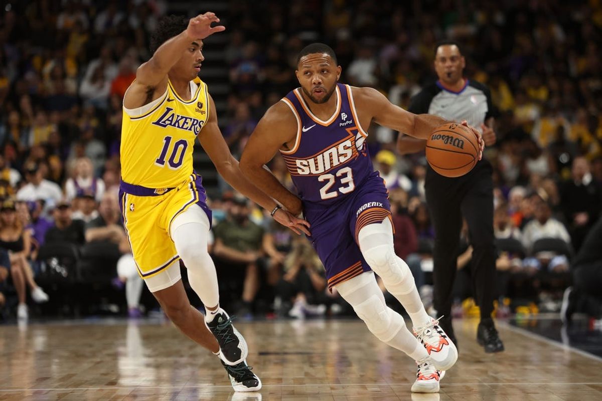 Oct 19, 2023; Palm Desert, California, USA;  Phoenix Suns guard Eric Gordon (23) dribbles the ball against Los Angeles Lakers guard Max Christie (10) during the first quarter at Acrisure Arena. Mandatory Credit: Kiyoshi Mio-USA TODAY Sports