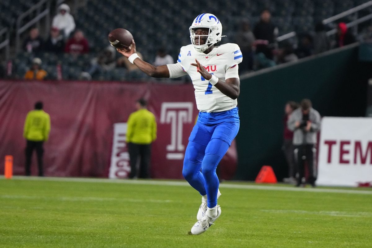 Oct 20, 2023; Philadelphia, Pennsylvania, USA; SMU Mustangs quarterback Kevin Jennings (7) throws the ball against the Temple Owls during the second half at Lincoln Financial Field. Mandatory Credit: Gregory Fisher-Imagn Images