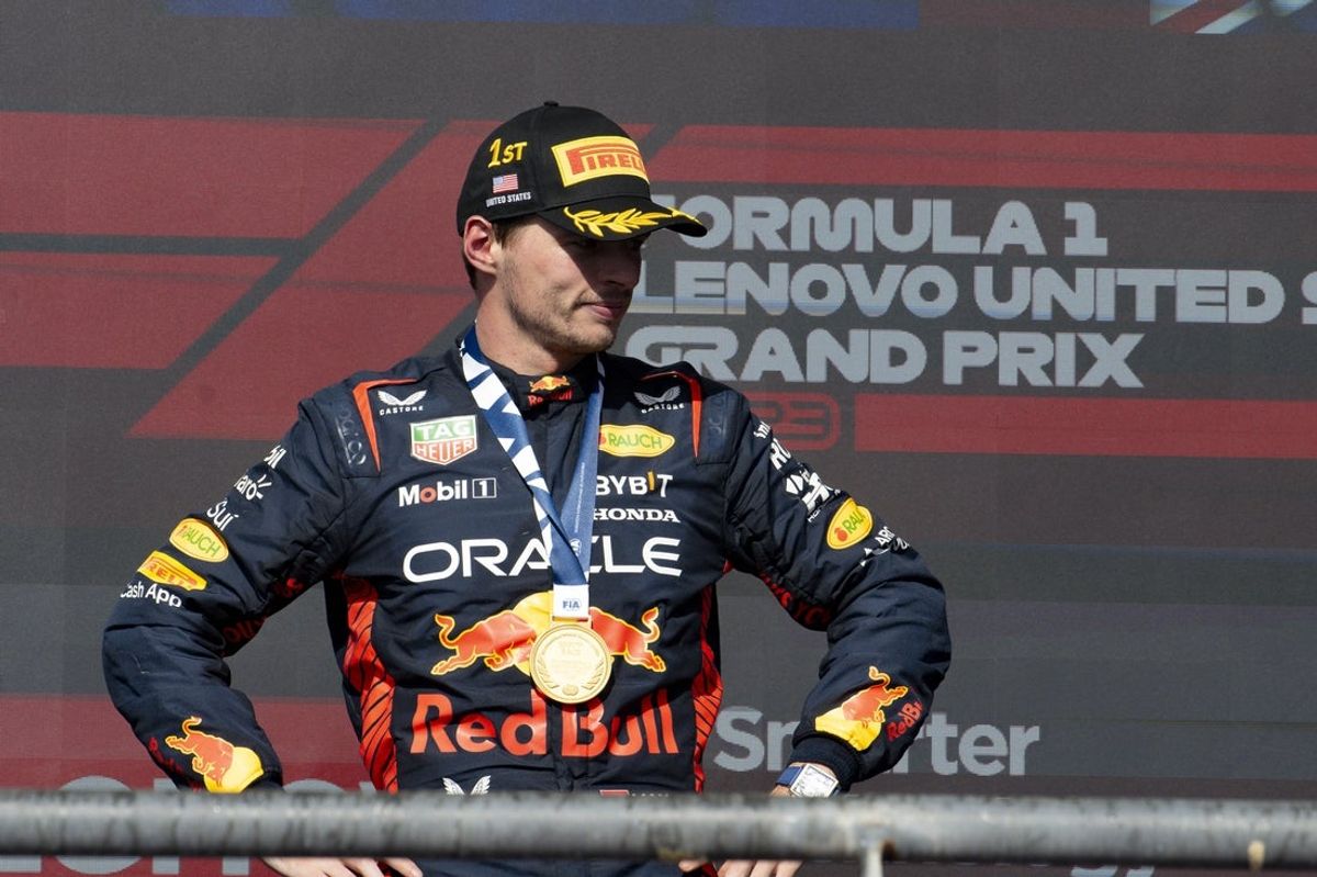 Oct 22, 2023; Austin, Texas, USA; Red Bull Racing Honda driver Max Verstappen (1) of Team Netherlands smiles to the crowd after he wins the 2023 United States Grand Prix at Circuit of the Americas. Mandatory Credit: Jerome Miron-Imagn Images