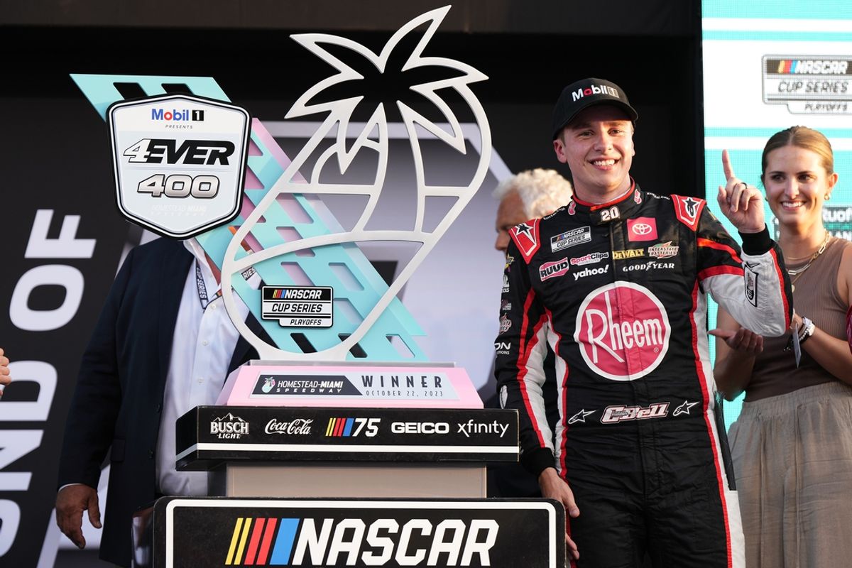 Oct 22, 2023; Homestead, Florida, USA; NASCAR Cup Series driver Christopher Bell (20) celebrates in victory lane after winning the 4EVER 400 presented by Mobil 1 at Homestead-Miami Speedway. Mandatory Credit: Jasen Vinlove-Imagn Images